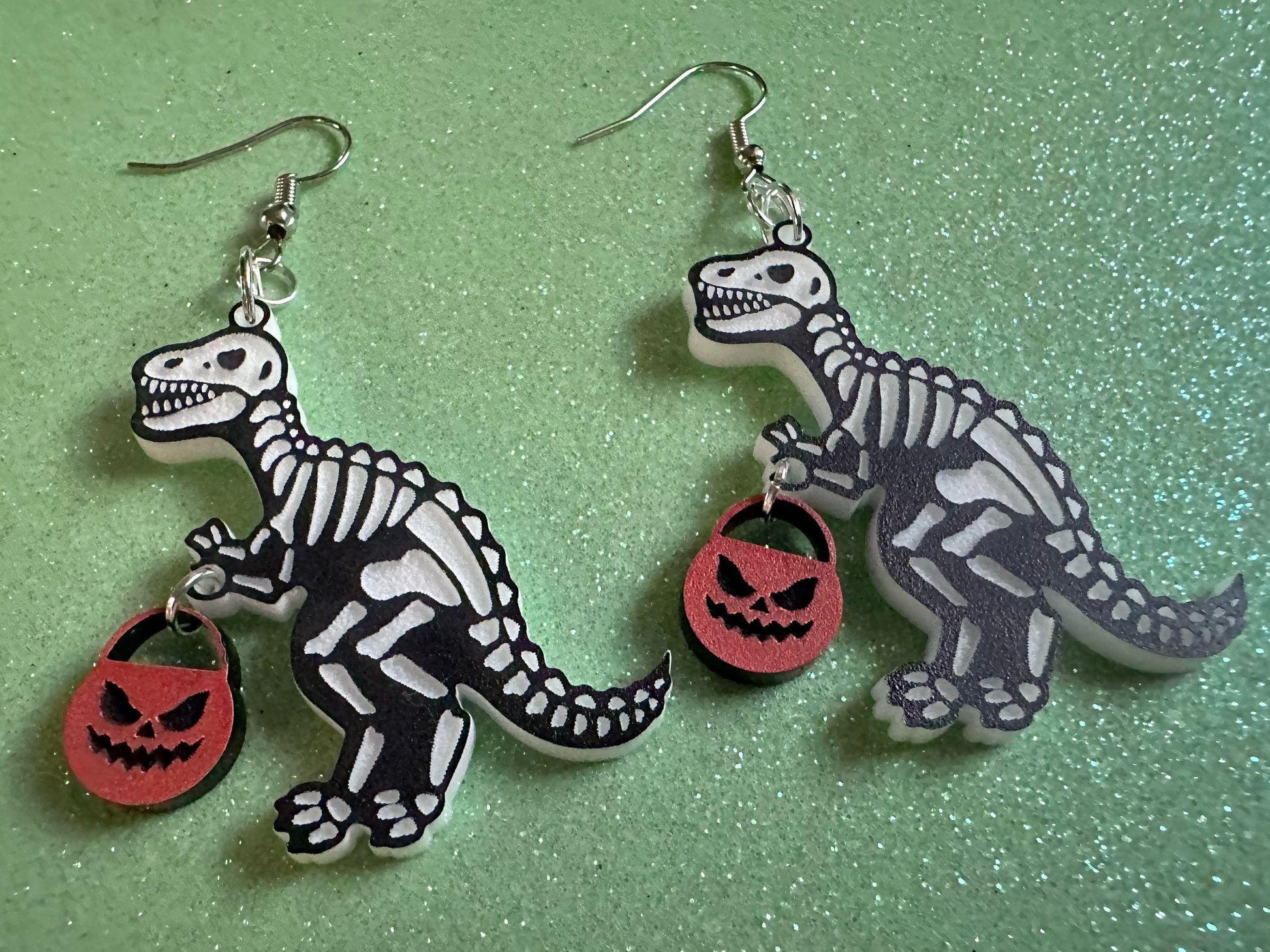 T-Rex Skeleton Earrings: Laser Cut Acrylic Dinosaurs with Jack-o-Lanterns, Halloween, Trick or Treat, Pumpkin, Best Gifts for Her/Him/Them